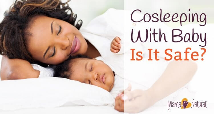 cute african mother and baby sleeping in bed